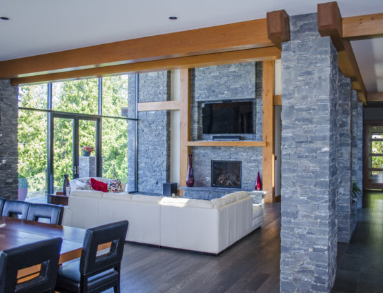Modern Open Concept Living Space Stone Columns Fireplace